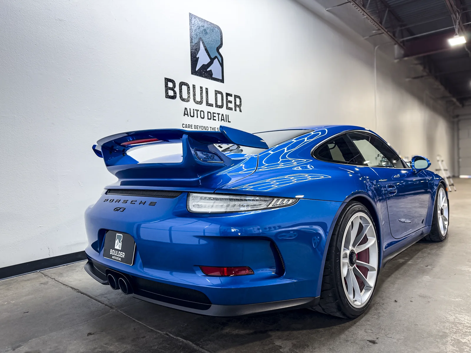 Rear three-quarter view of the Porsche 911 GT3 in the Boulder shop