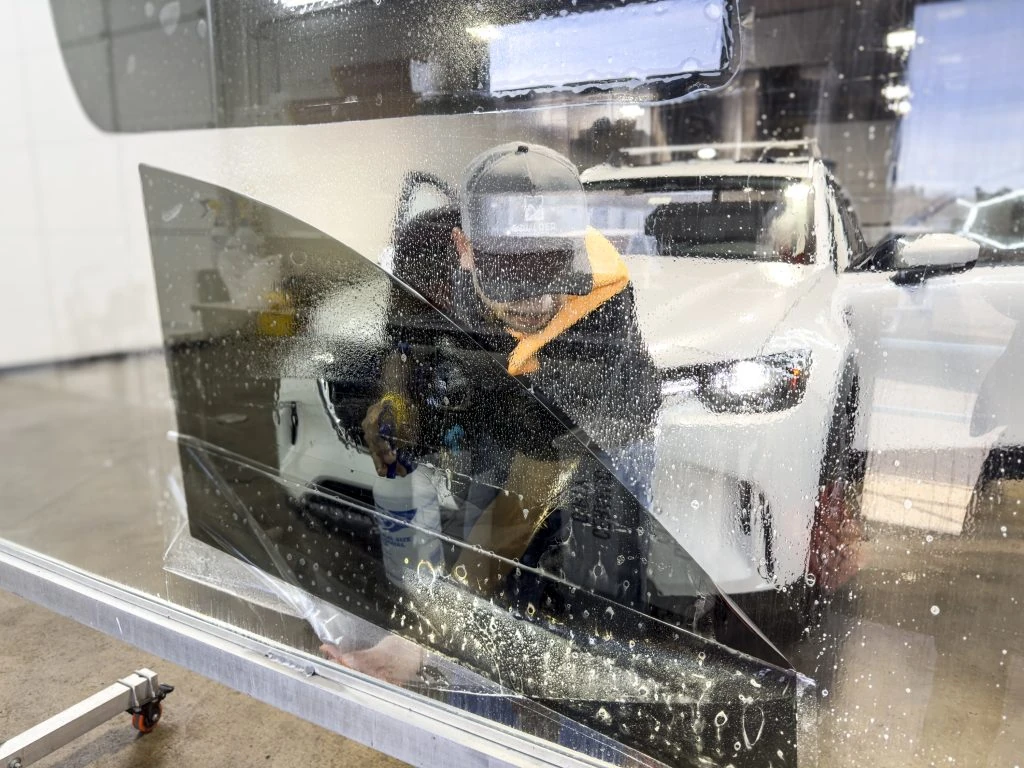 Window tint being installed at Boulder Auto Detail