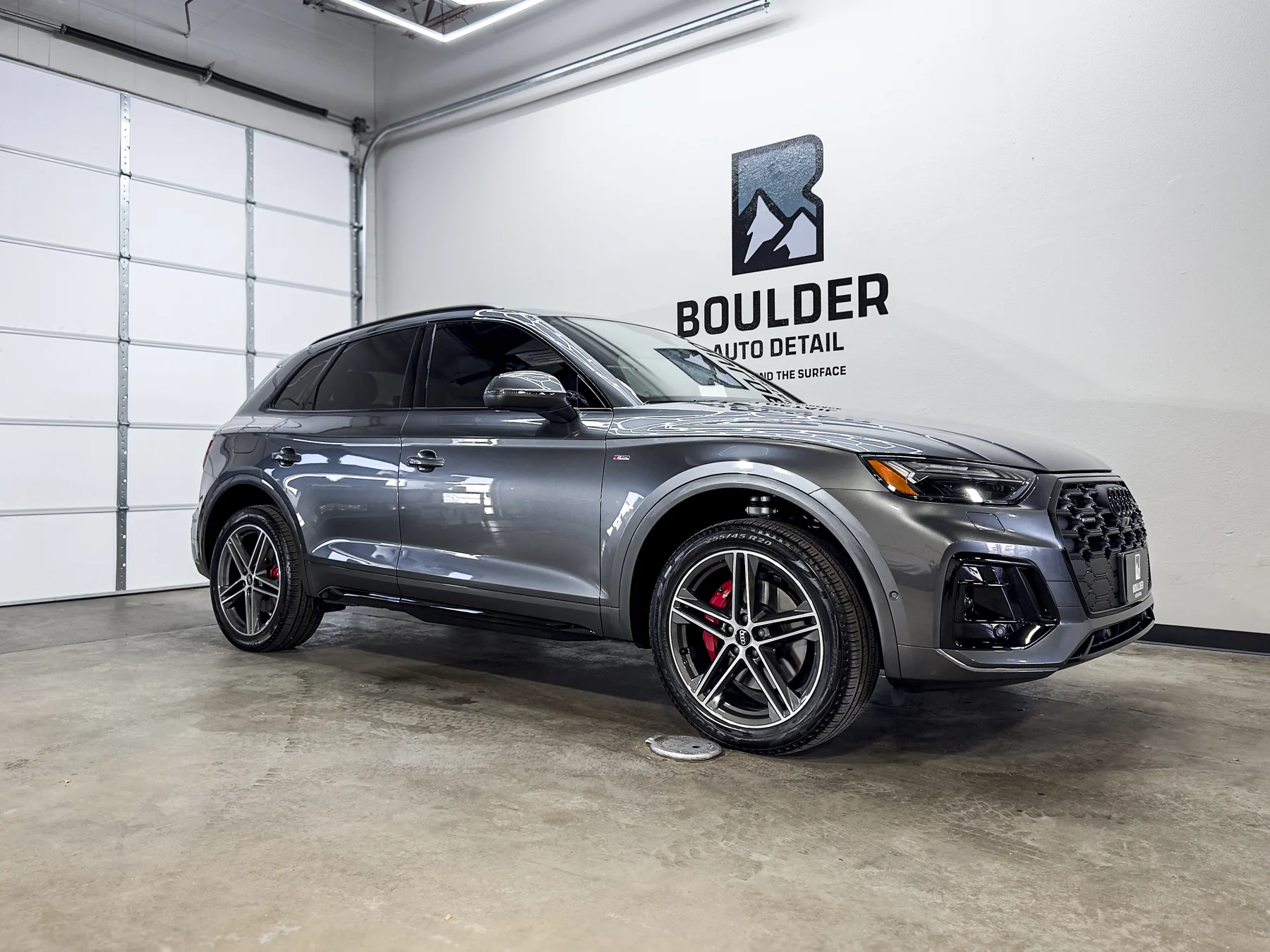 Gray BMW SUV photographed inside Boulder Auto Detail