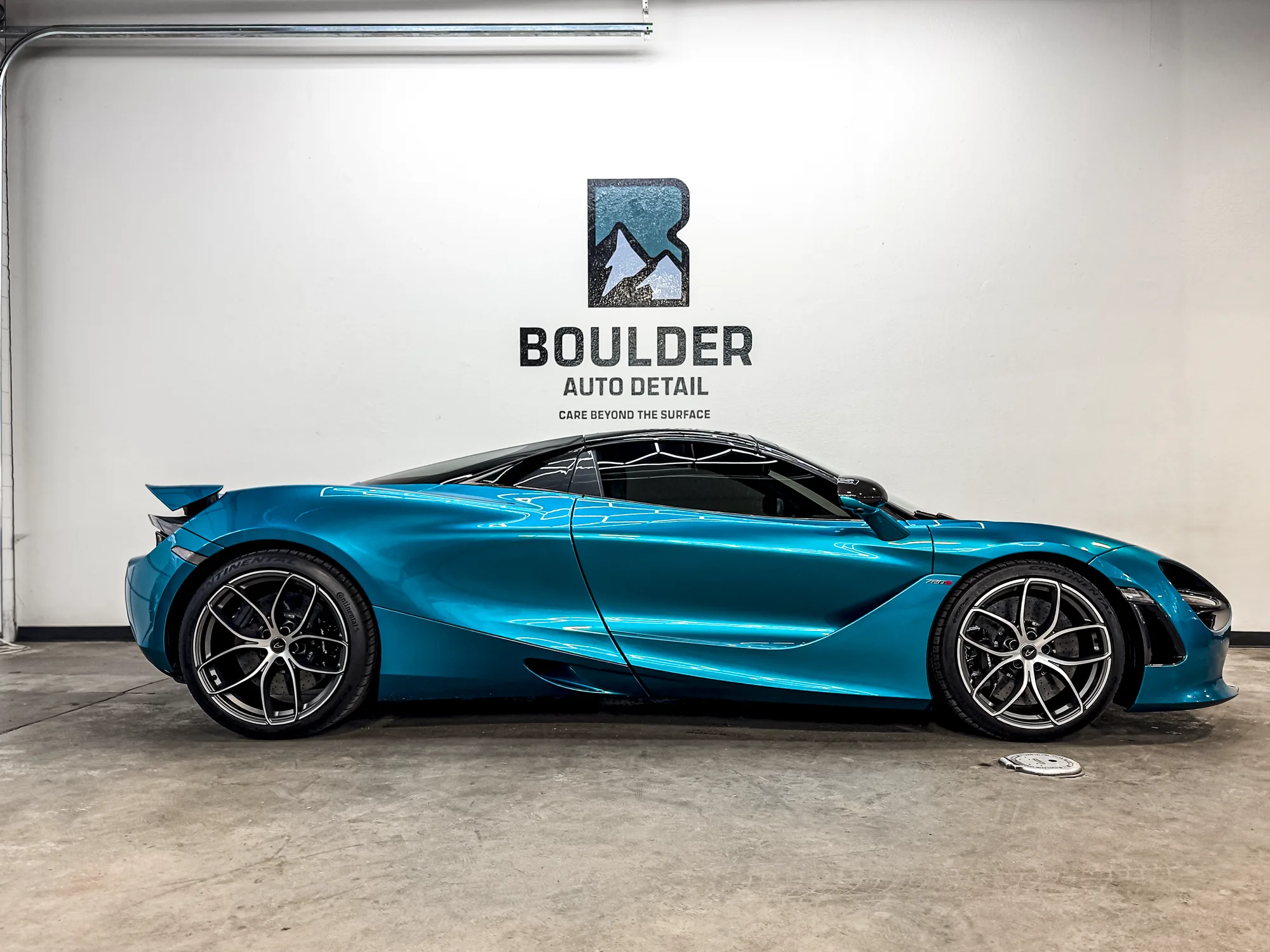 Blue McLaren photographed inside Boulder Auto Detail